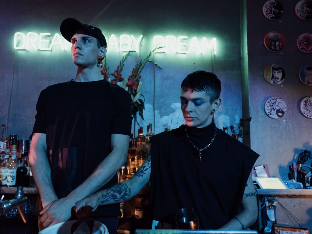 Two models wear items from the capsule collection